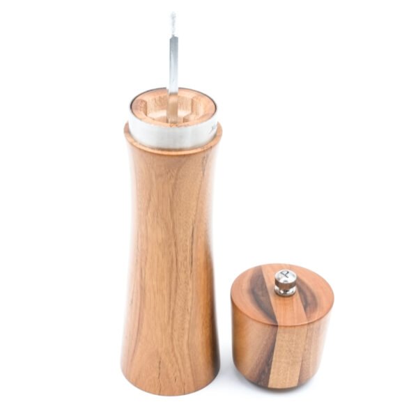 The top of the pepper mill can be opened to add pepper or salt.