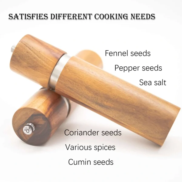 Handcrafted acacia wood salt and pepper grinders with ceramic mechanisms, displayed on a matching wooden tray with natural grain visible.