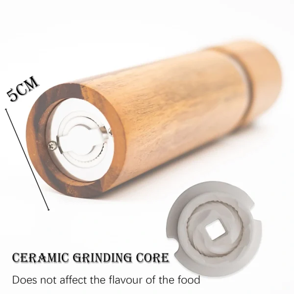 Acacia wood pepper grinder with ceramic grinding mechanism for salt and spices, showing natural wood grain texture.