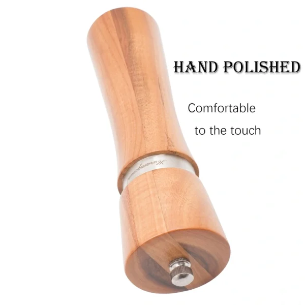Acacia wood pepper grinder with ceramic grinding mechanism for salt and spices, showing natural wood grain texture