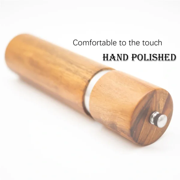 Acacia wood pepper grinder with ceramic grinding mechanism for salt and spices, showing natural wood grain texture.