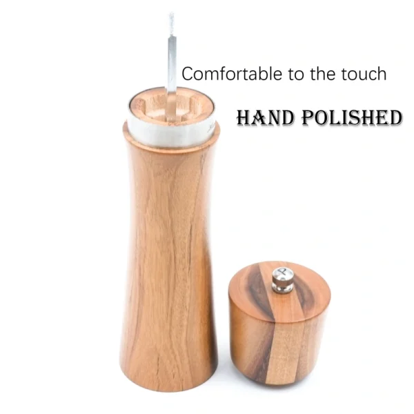 Handcrafted acacia wood salt and pepper grinders with ceramic mechanisms, displayed on a matching wooden tray with natural grain visible.