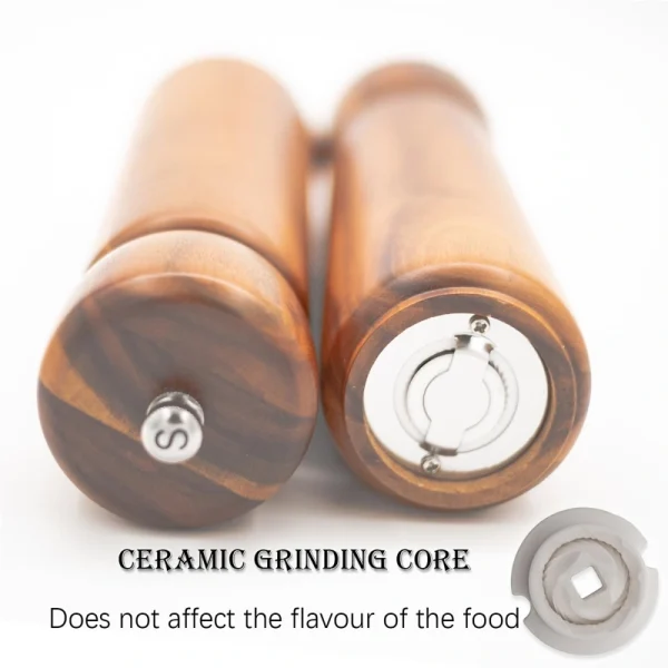 Acacia wood salt and pepper grinders with ceramic grinding cores, displayed on a matching wooden base.