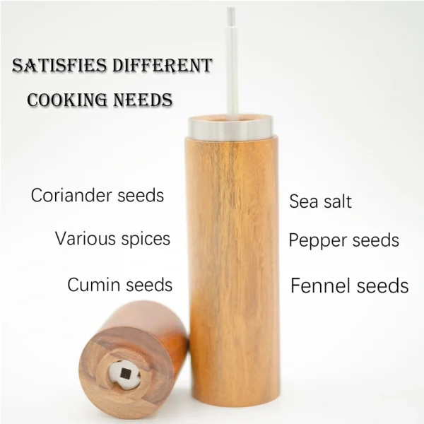 Acacia wood pepper grinder with ceramic grinding mechanism for salt and spices, showing natural wood grain texture.
