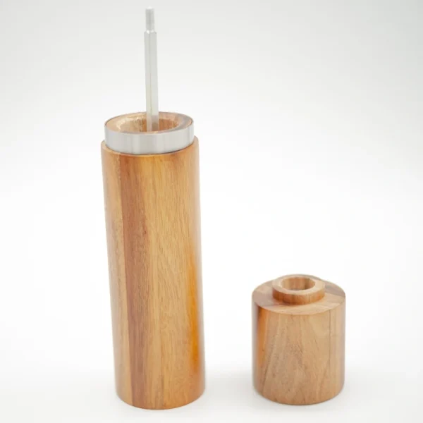 Acacia wood pepper grinder with ceramic grinding mechanism for salt and spices, showing natural wood grain texture.