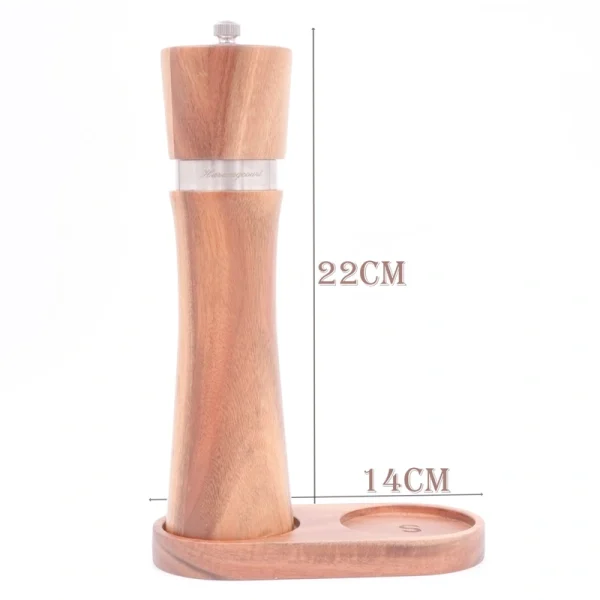 Handcrafted acacia wood salt and pepper grinders with ceramic mechanisms, displayed on a matching wooden tray with natural grain visible.
